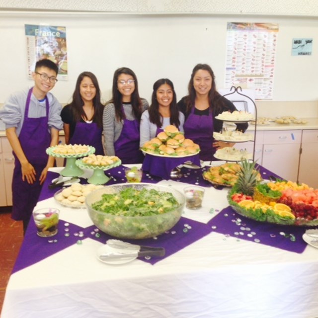 Santiago High School scholars prepare a healthy meal of fruits and vegetables. 